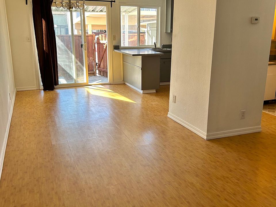 1st floor includes kitchen, dining area, living room, and 1/2 bathroom, with connected patio.