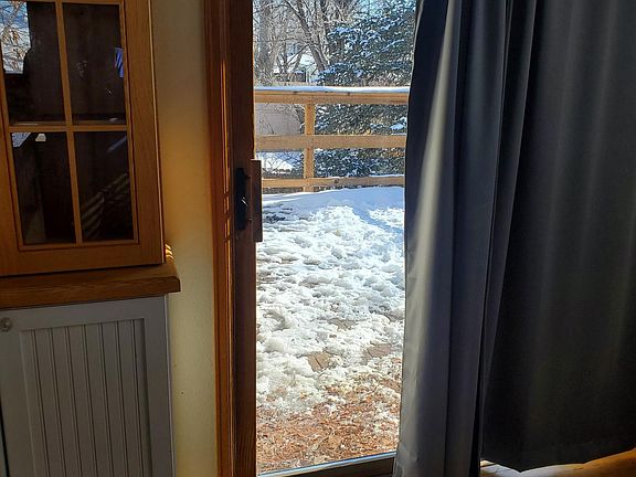 View from the kitchen to walk out deck. Deck was installed 1.5 years ago.