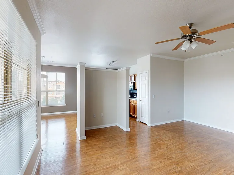 Apartment living room with wood-style flooring.