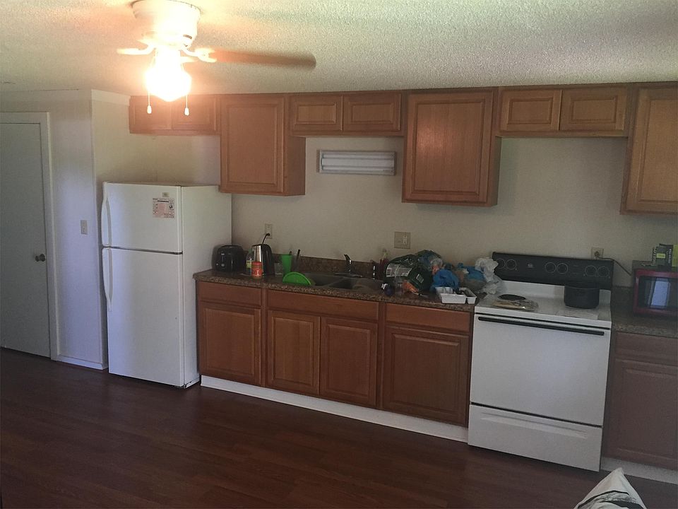 Kitchen is combined with living room.