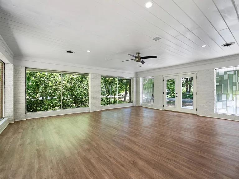 Sunroom with panoramic windows of your private park like setting.