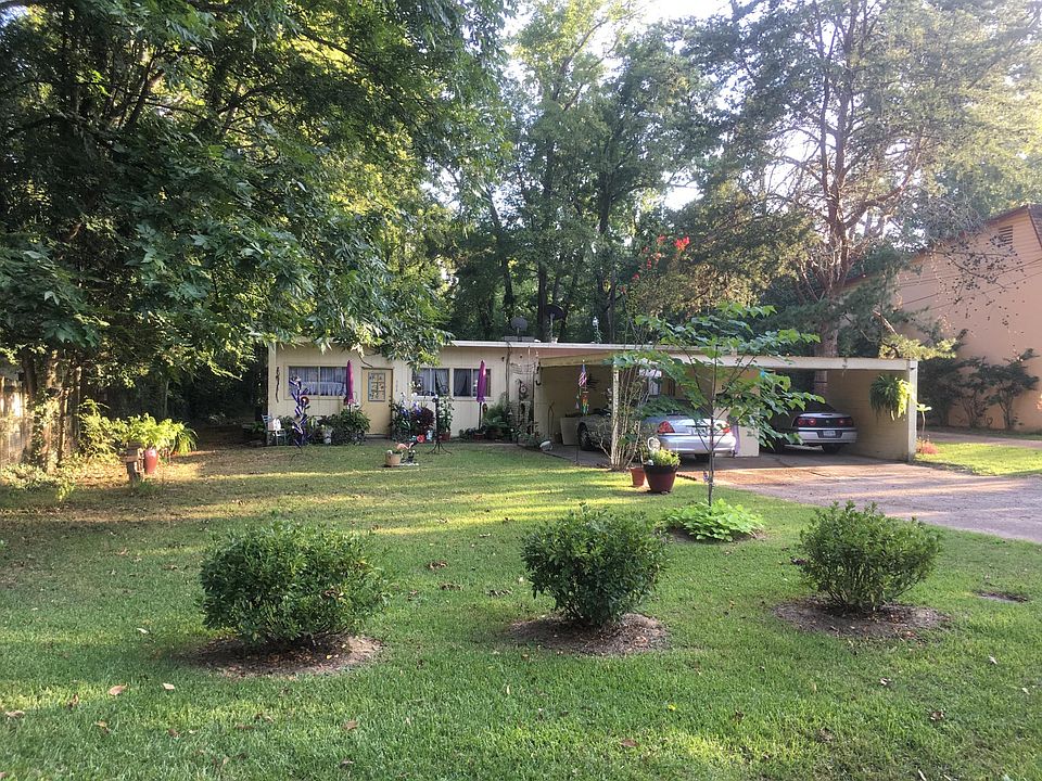Front of unit showing the covered parking space.