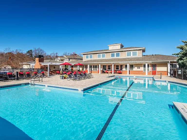 Resort-style swimming pool and outdoor resident amenities at Village at Broadstone Station in Apex, North Carolina