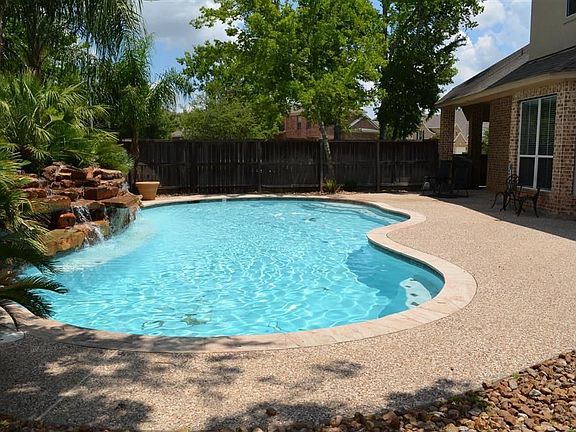 Huge pool with private back yard.