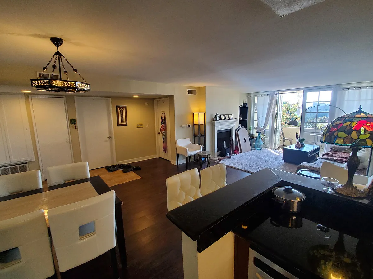 View of living room from kitchen. Dishwasher. - 1430 Colby Ave #206