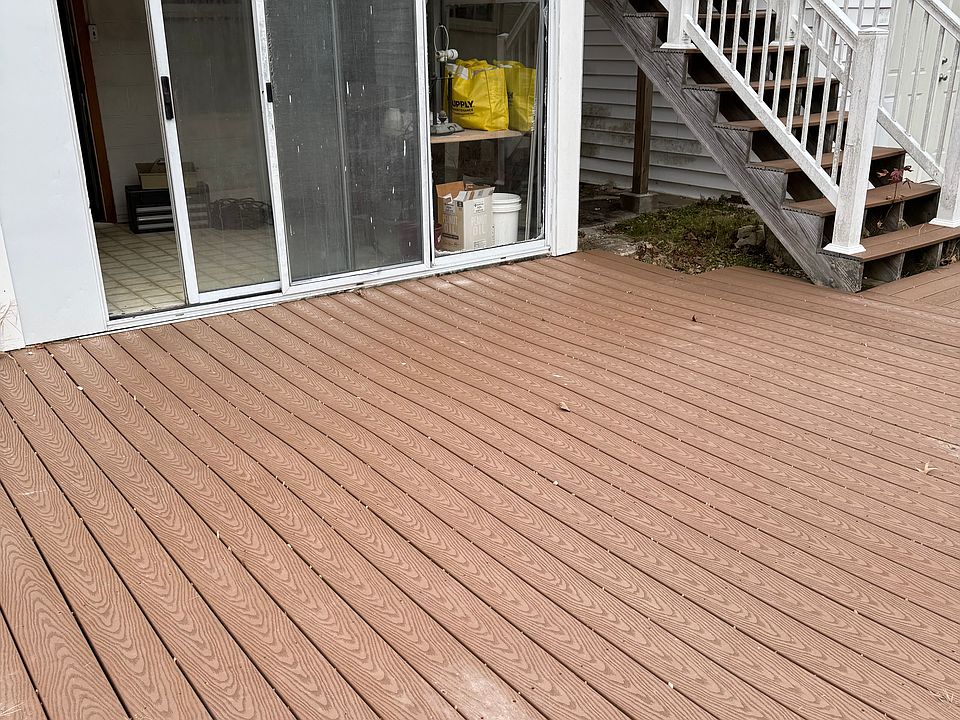Main entrance with new patio area and screen room.