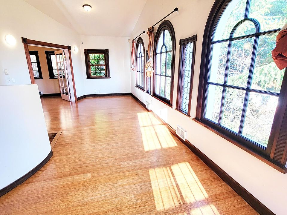 Three arched windows in the long living room