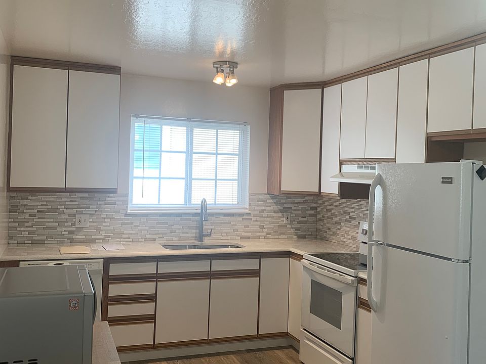 Kitchen, quartz countertops, dishwasher, garbage disposal, electric range and refrigerator.