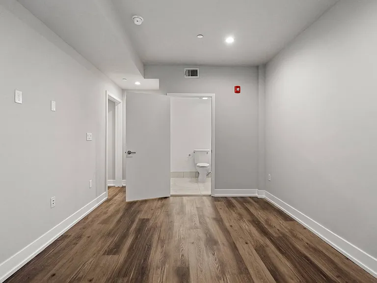 Bedroom with Vinyl Flooring and Bathroom