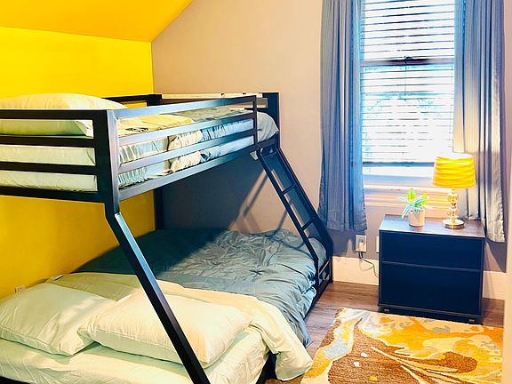 twin over full bunk beds for small or big kids with children's books and toys onsite