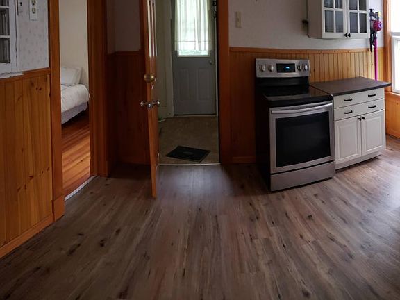 panoramic view of kitchen. There is a new Stainless Steel over the stove microwave hood installed, not seen here in the photos.
