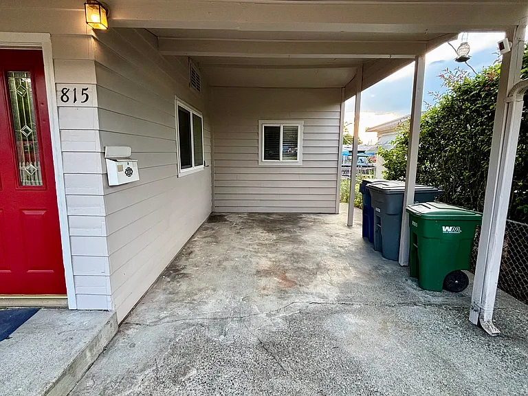 Covered carport plus detached single car garage