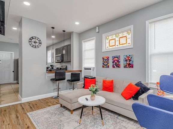 Open living/kitchen area with breakfast bar