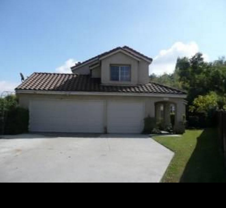 Long private driveway leading to 3 car Garage