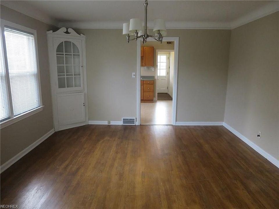Dining room leading to kitchen and back exit and sunroom