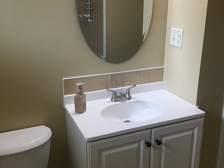 Bathroom has update vanity, toilet and accessories.