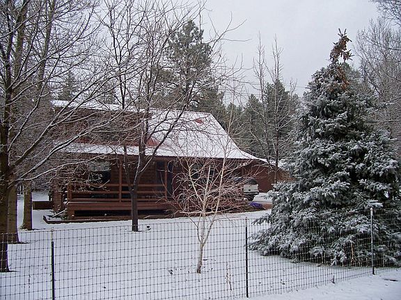 2nd view of front of log cabin in winter