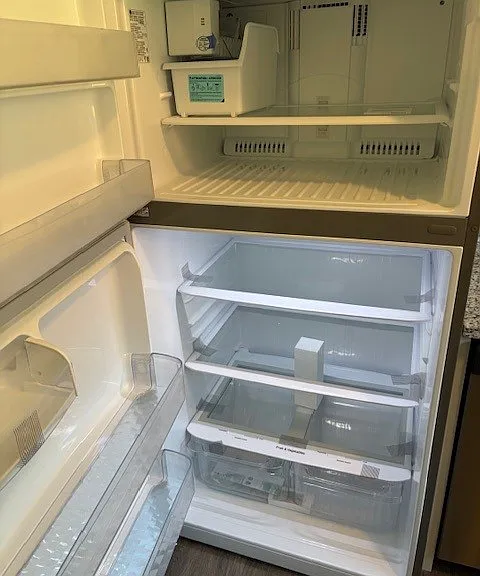 Refrigerator with Icemaker and plenty of cold storage.