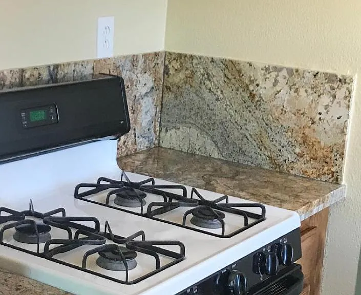 Fictional kitchen with microwave hood, gull size gas stove and sink