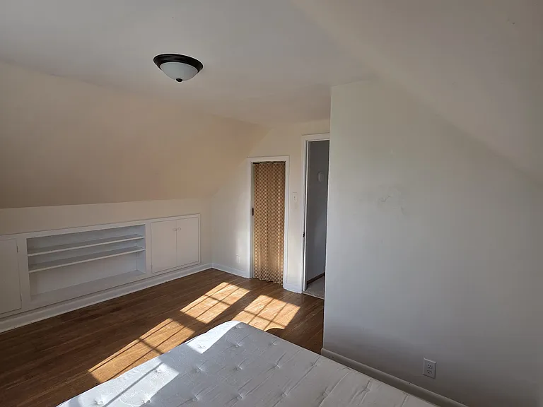 Upstairs Bedroom 2 - spacious closet as well as built-in cabinets for storage.