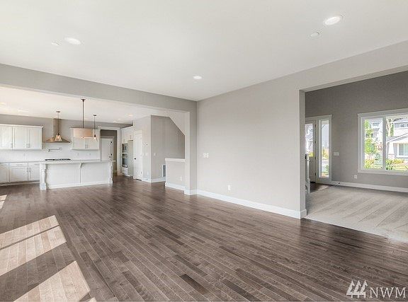 Hampton 4438 sf plan , elevation A ( Lot 8) is under construction, this photo is of another home and floorplan in a different community.  This photo is to be viewed as a sample of the different exterior colors, designs, details and finishes.