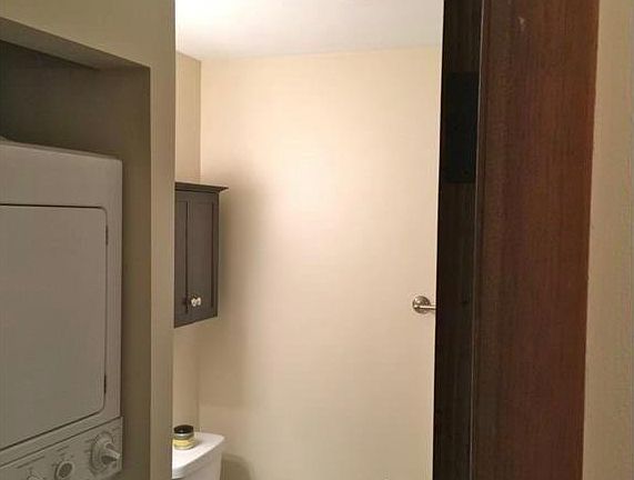 full bath with stackable washer/dryer
