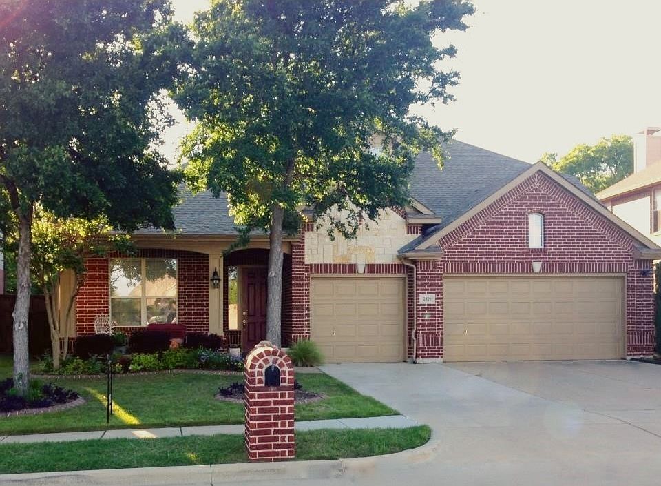 Porch and 3 car garage!