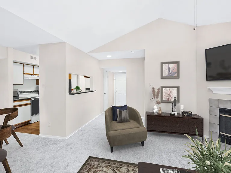 Living areas with plush carpet and wood-burning fireplace