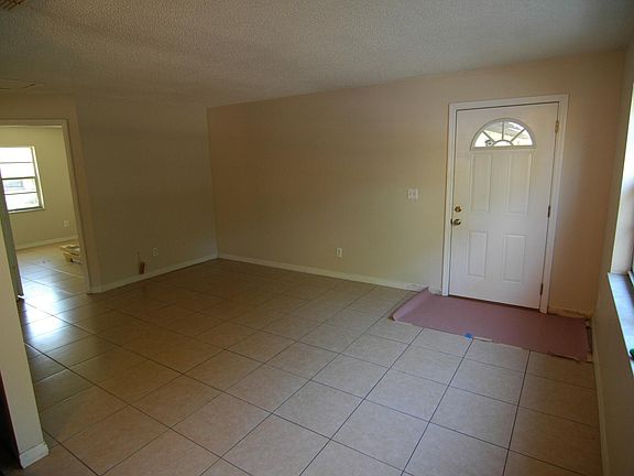 Front Door and comfortable Living room area