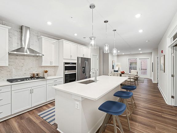 Gourmet Kitchen Opening to the Cafe and Gathering Room