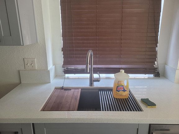 Motion sensored faucet, 10 inch depth stainless steel sink with removeable cutting boared and drying rack.