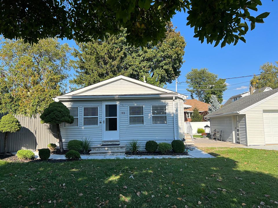 Front of house with entrance into the enclosed porch area