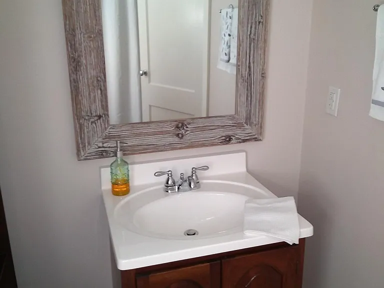 Farmhouse style bath on main level.