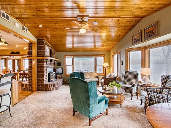 family room off of kitchen with 2 sided fireplace
