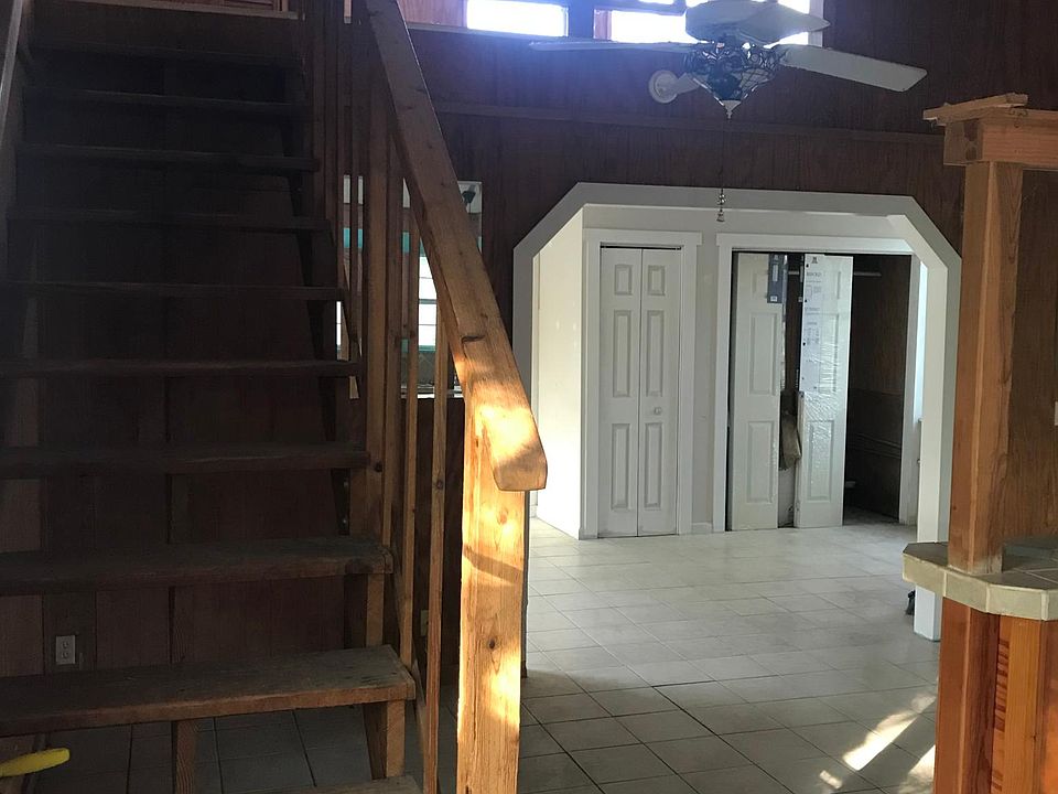 Entry way with view to living room and loft