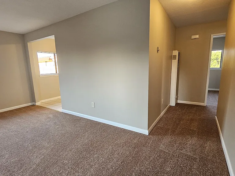 Living room and hallway viewed from front door.