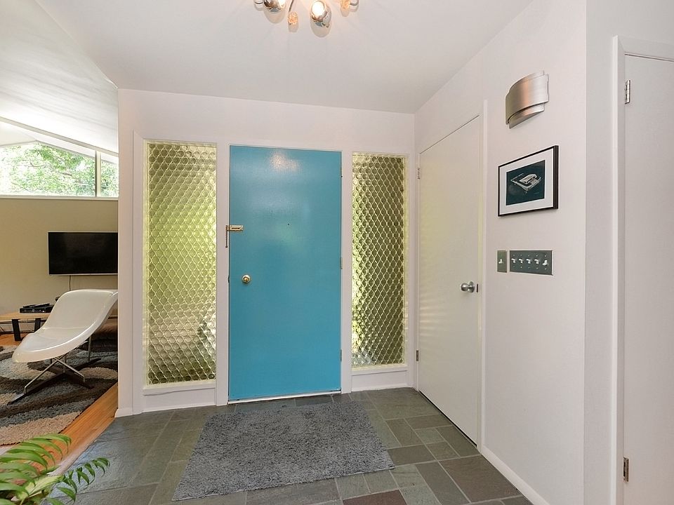 Front door flanked by glass