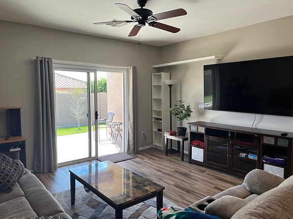 Living room with huge 75" smart TV.