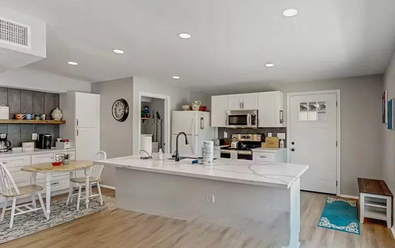 Kitchen and Washer / Dryer Room center of picture.