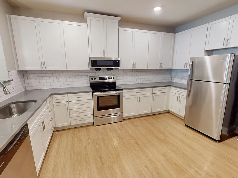 The Presley floor plan features a large kitchen with an abundance of cabinet space and stainless steal appliances, including a dishwasher and microwave. The Presley floor plan features a large kitchen with an abundance of cabinet space and stainless steal