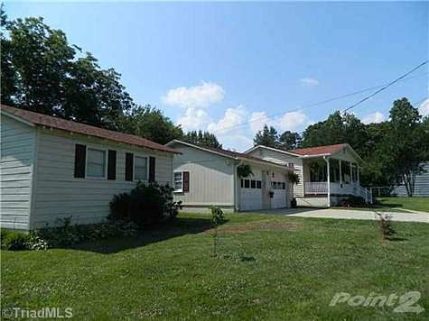 Features Detached Double Garage and a Wired Workshop that is heated and cooled!