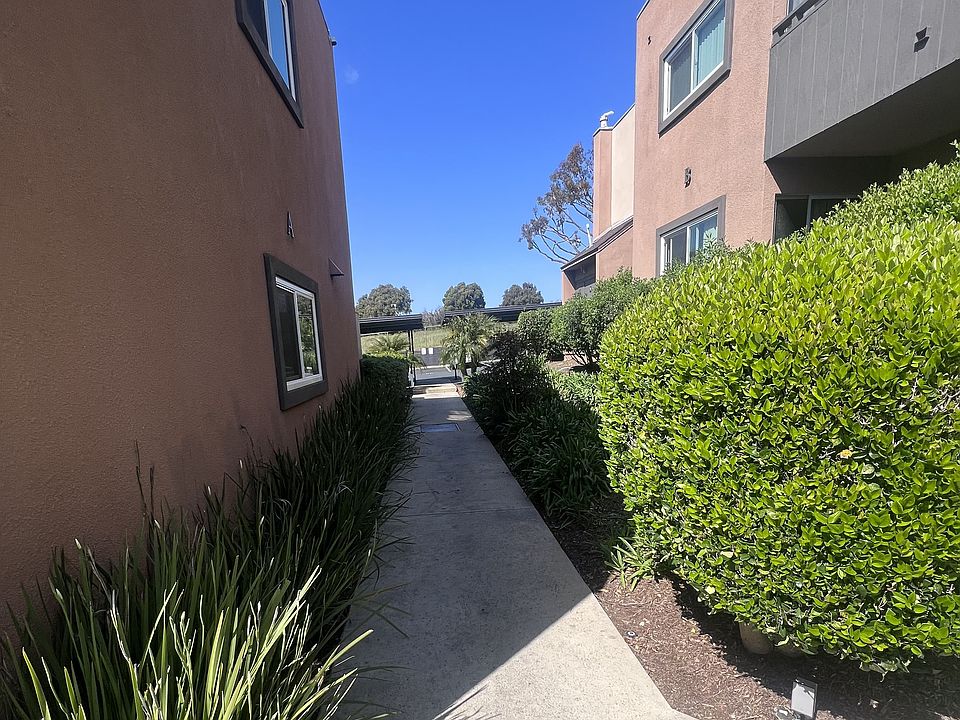 Walkway between apartment buildings at Villa Pacific Apartments in Oceanside, California.