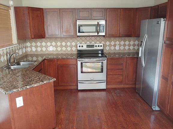 Kitchen with stainless steel appliances.