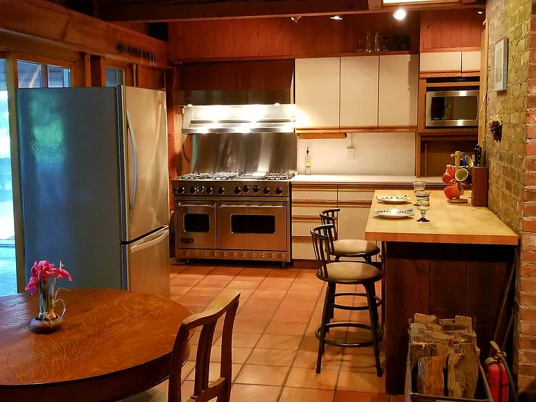 Kitchen eating area. (another wood stove)