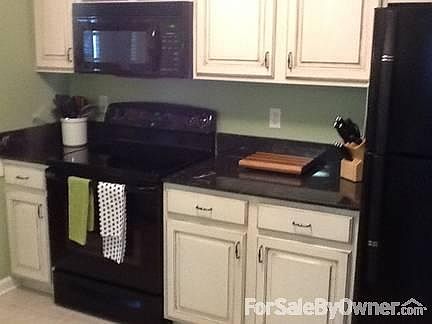 Completely renovated kitchen
						:
						Black appliances, custom built cabinets, tile flooring, built in microwave