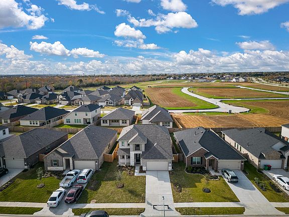 This home sits on a large lot with ample yard space in front and the back, lush landscaping and a we