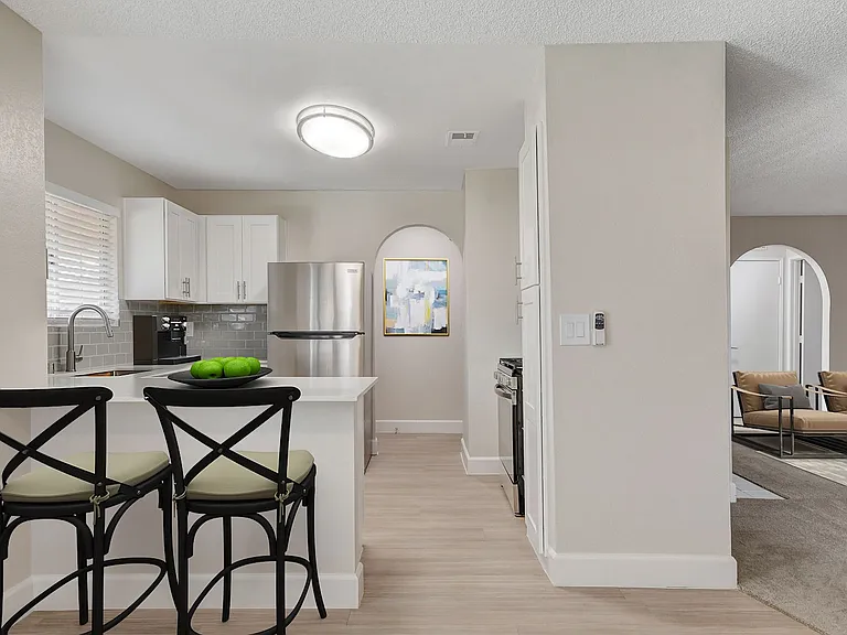Welcome to Invitational, where modern elegance meets comfort. This stunning kitchen features sleek cabinetry, spacious countertops, and an open layout perfect for entertaining. Elevate your lifestyle todayschedule a tour and see for yourself!