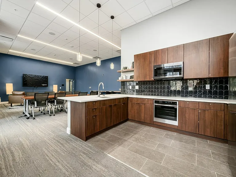 The Community Clubroom Kitchen is fully equipped with exquisite stainless steel appliances, a tap to turn on kitchen faucet, ice maker, and oversized refrigerator and freezer space.