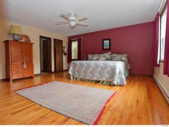 Stretch out in truly spacious Master Bedroom ensuite, complete with two walk-in closets, and private full bath. Note the second of two ceiling fans included.  The other is in the main level Big Family Room.