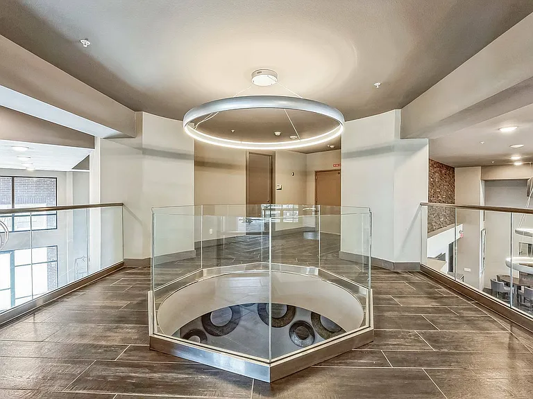 Sleek upper-level walkway with designer lighting